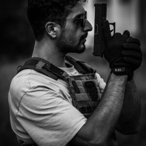 Man Holding a Gun in Black and White